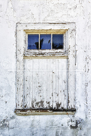 A Window On A White Barn